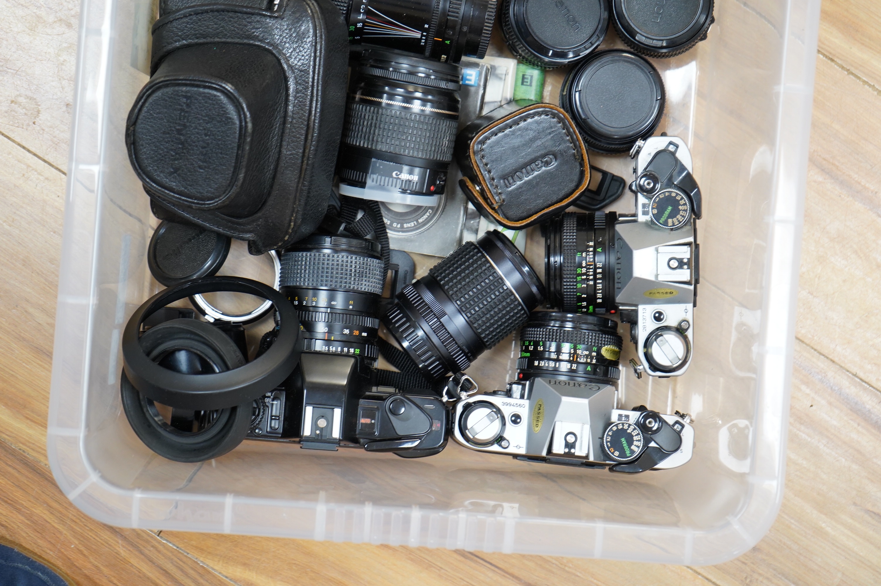 A quantity of various cameras and lenses to include Olympus, Minolta, Pentax and Canon. Condition - varies